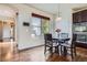 Bright breakfast nook with a round table, chairs, and a view of the outdoors at 7485 S Jackson Gap Way, Aurora, CO 80016