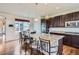 Spacious kitchen features a granite island, stainless steel appliances, and a breakfast nook at 7485 S Jackson Gap Way, Aurora, CO 80016