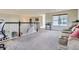 Cozy loft featuring plush carpeting, ample natural light and stair access to lower level at 7485 S Jackson Gap Way, Aurora, CO 80016