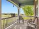 Inviting front porch with comfortable seating, perfect for enjoying the views and relaxing outdoors at 7485 S Jackson Gap Way, Aurora, CO 80016