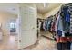 A generously sized walk-in closet with ample shelving and hanging space at 7485 S Jackson Gap Way, Aurora, CO 80016