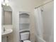 Small bathroom with toilet, sink, and bathtub at 6000 W Floyd Ave # 105, Denver, CO 80227