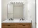 Modern bathroom with double vanity and updated fixtures at 6000 W Floyd Ave # 105, Denver, CO 80227