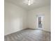 Bright bedroom with carpet and access to balcony at 6000 W Floyd Ave # 105, Denver, CO 80227