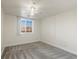 Bright bedroom with window, ceiling fan and carpet at 6000 W Floyd Ave # 105, Denver, CO 80227