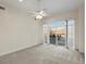 Bedroom with carpet flooring and access to balcony at 6000 W Floyd Ave # 105, Denver, CO 80227