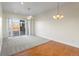 Bright dining room with hardwood floors and access to deck at 6000 W Floyd Ave # 105, Denver, CO 80227