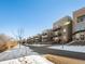Community view of building with snow on the ground at 6000 W Floyd Ave # 105, Denver, CO 80227