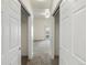 Hallway with bedroom access and view of balcony at 6000 W Floyd Ave # 105, Denver, CO 80227