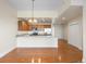 Kitchen features granite countertops and hardwood floors at 6000 W Floyd Ave # 105, Denver, CO 80227