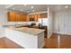 Well-lit kitchen with granite countertops, stainless steel appliances, and ample cabinetry for a modern look at 6000 W Floyd Ave # 105, Denver, CO 80227