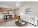 Kitchen with granite countertops, stainless steel appliances, and hardwood floors at 6000 W Floyd Ave # 105, Denver, CO 80227