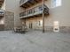 Private patio with table and chairs, great for outdoor dining at 6000 W Floyd Ave # 105, Denver, CO 80227