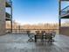 Enjoy serene views from this private patio, featuring a table and chairs at 6000 W Floyd Ave # 105, Denver, CO 80227