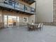 Outdoor patio with seating area and building access at 6000 W Floyd Ave # 105, Denver, CO 80227