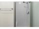 Clean shower with tiled walls and built-in seat at 6000 W Floyd Ave # 105, Denver, CO 80227