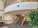 Modern stairwell with wood and metal accents at 6000 W Floyd Ave # 105, Denver, CO 80227