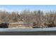 Nature views from the property featuring trees and a river at 6000 W Floyd Ave # 105, Denver, CO 80227