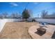 The large backyard with a patio is fenced for privacy at 1560 Clinton St, Aurora, CO 80010