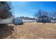 This fenced backyard includes a storage shed and a patio perfect for relaxing at 1560 Clinton St, Aurora, CO 80010