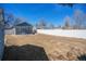 Backyard features a full fence, storage shed, and patio at 1560 Clinton St, Aurora, CO 80010