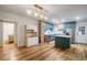 Well-lit kitchen features an island and modern appliances, creating an efficient and inviting cooking space at 1560 Clinton St, Aurora, CO 80010