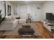 Comfortable living room with natural light and a view of the front door, creating an inviting and welcoming space at 1560 Clinton St, Aurora, CO 80010