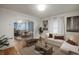 Open living room flows into the kitchen, offering a spacious and inviting atmosphere for relaxation and entertaining at 1560 Clinton St, Aurora, CO 80010