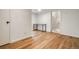 Office with hardwood flooring, desk, and white walls, with an entrance to what appears to be stairs at 1560 Clinton St, Aurora, CO 80010