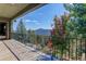 Enjoy scenic mountain views from the balcony, surrounded by lush trees at 28154 Belle Mont Trl, Conifer, CO 80433
