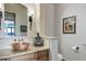 Elegant bathroom featuring a copper sink, granite countertop, and decorative Buddha statue at 28154 Belle Mont Trl, Conifer, CO 80433