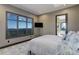 Bedroom with mountain views, a wall-mounted TV, and ensuite bathroom at 28154 Belle Mont Trl, Conifer, CO 80433
