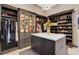 Well-organized closet boasts custom shelving, cabinets, and center island for storage at 28154 Belle Mont Trl, Conifer, CO 80433