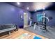 Spacious home gym features various workout equipment and hardwood floors in the basement at 28154 Belle Mont Trl, Conifer, CO 80433