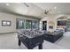 Large game room with foosball table, fireplace, bar, and view from the many windows at 28154 Belle Mont Trl, Conifer, CO 80433