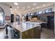 Spacious kitchen with large island, stainless steel appliances, custom cabinetry, and hardwood floors at 28154 Belle Mont Trl, Conifer, CO 80433