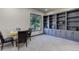 Office space with built-in shelving and drawers, large window, and decorative table at 28154 Belle Mont Trl, Conifer, CO 80433