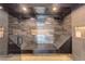 Modern shower featuring built in bench and decorative tiling, with shelving niche at 28154 Belle Mont Trl, Conifer, CO 80433