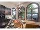 Cozy sitting area featuring views, custom cabinets, hardwood floors, and modern lighting at 28154 Belle Mont Trl, Conifer, CO 80433