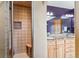Bathroom with walk-in tiled shower and double sink vanity with granite countertop and wood cabinets at 278 Snowshoe Cir, Breckenridge, CO 80424