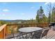 Spacious deck with metal table and chairs offer a relaxing space to entertain while enjoying the views at 278 Snowshoe Cir, Breckenridge, CO 80424