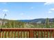 Capture the stunning view from the deck into the mountainous surrounding pine tree forest at 278 Snowshoe Cir, Breckenridge, CO 80424
