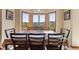 Dining room showcases breathtaking mountain views through large windows and comfortable seating arrangement at 278 Snowshoe Cir, Breckenridge, CO 80424