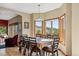 Elegant dining area features large windows with views, a modern light fixture, and seating for eight at 278 Snowshoe Cir, Breckenridge, CO 80424