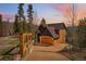 Inviting home exterior features an attached garage, paved driveway, and charming stone and wood accents at 278 Snowshoe Cir, Breckenridge, CO 80424