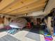 Organized garage space with a car under a cover, tools, and storage solutions at 278 Snowshoe Cir, Breckenridge, CO 80424