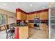 Well-lit kitchen features stainless steel appliances, granite countertops and a breakfast bar with seating at 278 Snowshoe Cir, Breckenridge, CO 80424