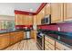 Kitchen featuring stainless steel appliances, granite countertops, and beautiful oak cabinets at 278 Snowshoe Cir, Breckenridge, CO 80424