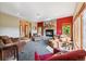 Cozy living room with a stone fireplace, comfortable seating, and large windows offering natural light at 278 Snowshoe Cir, Breckenridge, CO 80424