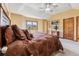 Bedroom with ensuite bathroom, vaulted ceilings, ceiling fan and picture window with mountain view at 278 Snowshoe Cir, Breckenridge, CO 80424